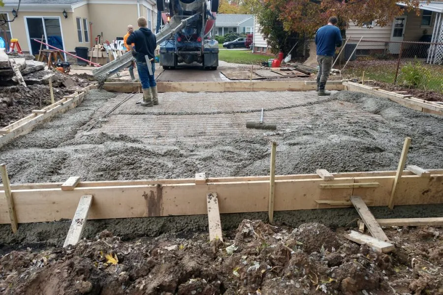 How Long Concrete Takes: Pouring, Curing and First Use